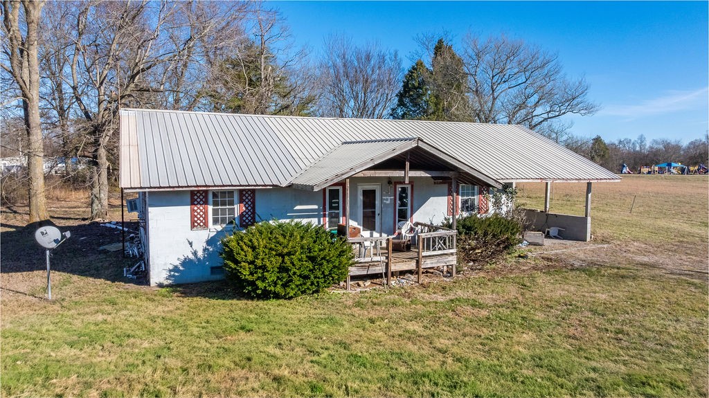 7560 Old Madisonville Road Hopkinsville, KY 42240 - Photo 3 of 31 a view of a house with backyard and sitting area