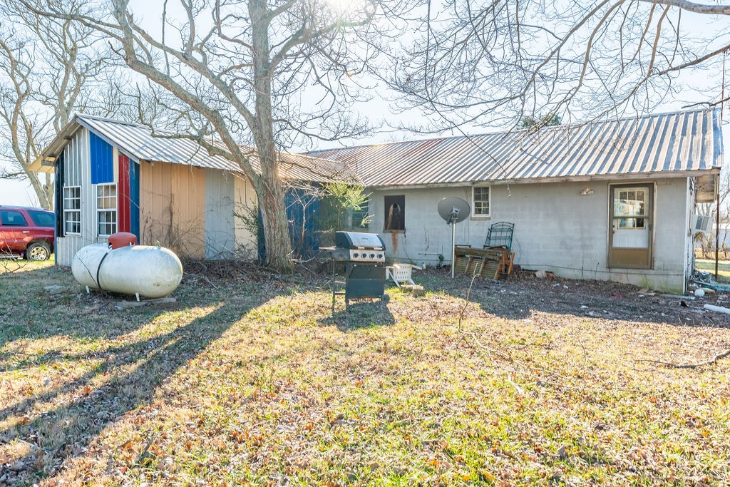 7560 Old Madisonville Road Hopkinsville, KY 42240 - Photo 31 of 31 a view of a house with backyard and sitting area