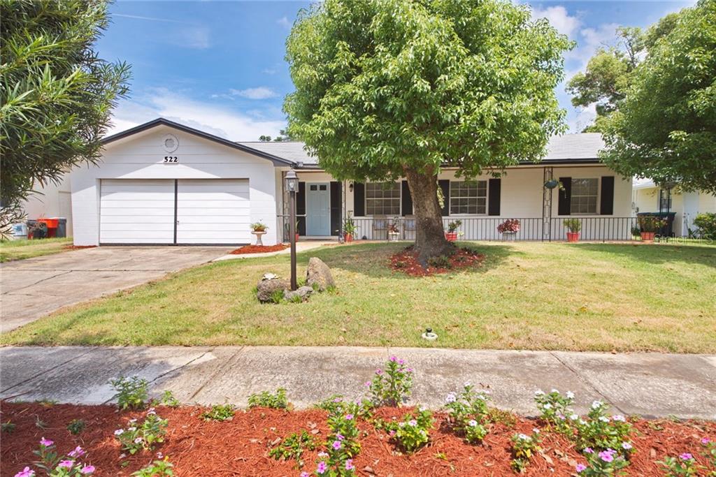 522 Friar Road Winter Park, FL 32792 - Photo 1 of 1 a backyard of a house with yard and outdoor seating