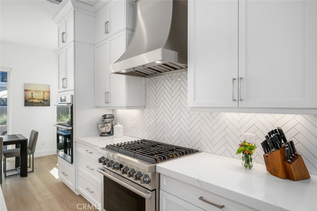 4019 Hillside Drive San Luis Obispo, CA 93401 - Photo 11 of 32 a kitchen with white cabinets and a stove