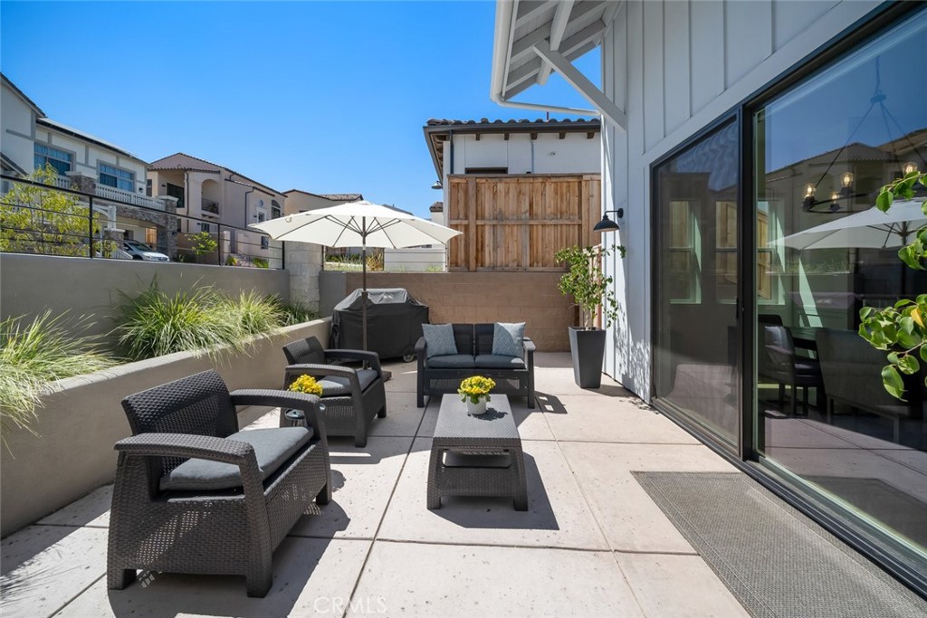 4019 Hillside Drive San Luis Obispo, CA 93401 - Photo 13 of 32 a view of a patio with couches and a potted plant on a table and chairs