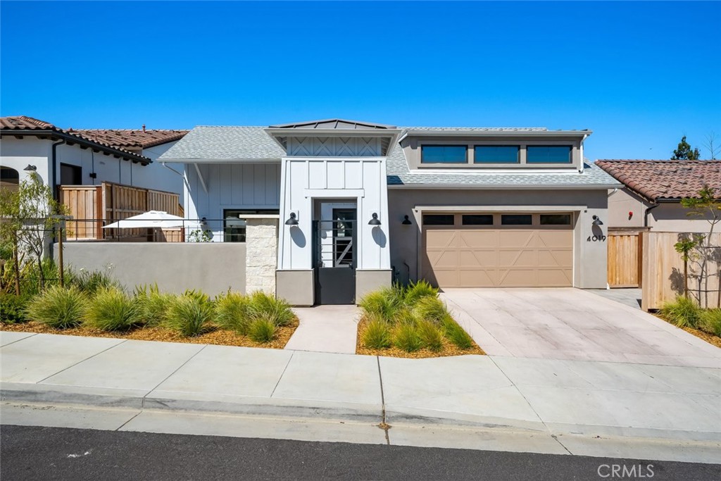 4019 Hillside Drive San Luis Obispo, CA 93401 - Photo 2 of 32 a front view of a house with a yard and garage