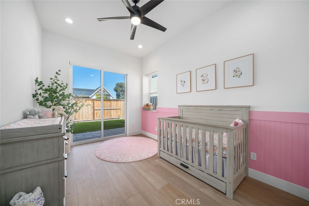 4019 Hillside Drive San Luis Obispo, CA 93401 - Photo 23 of 32 a bed room with a bed and a chandelier