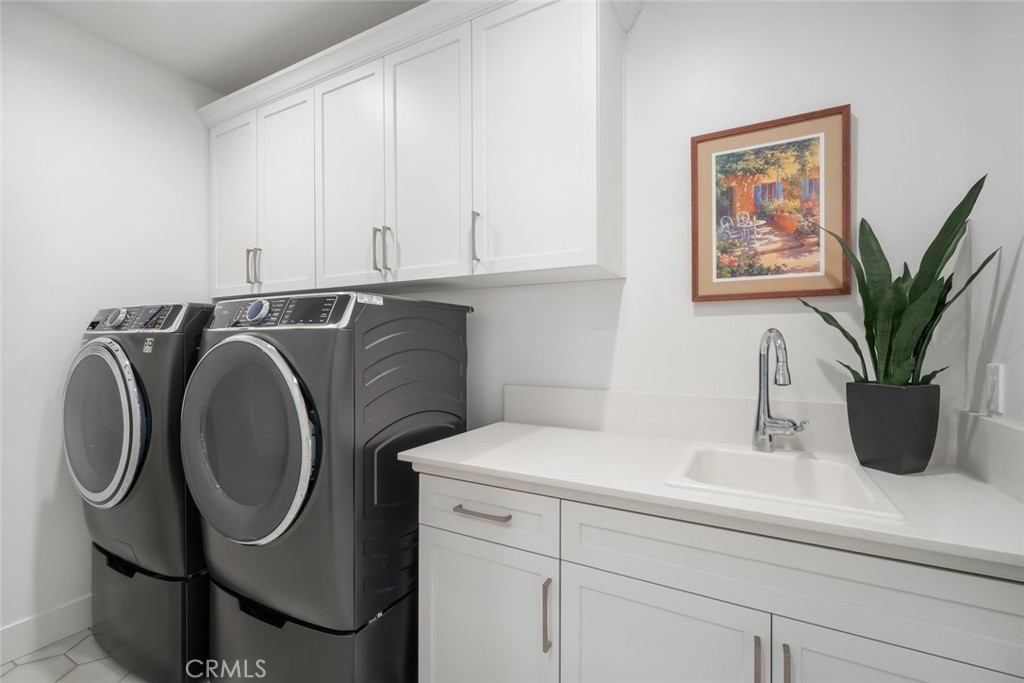 4019 Hillside Drive San Luis Obispo, CA 93401 - Photo 29 of 32 a bathroom with a sink a washer and dryer