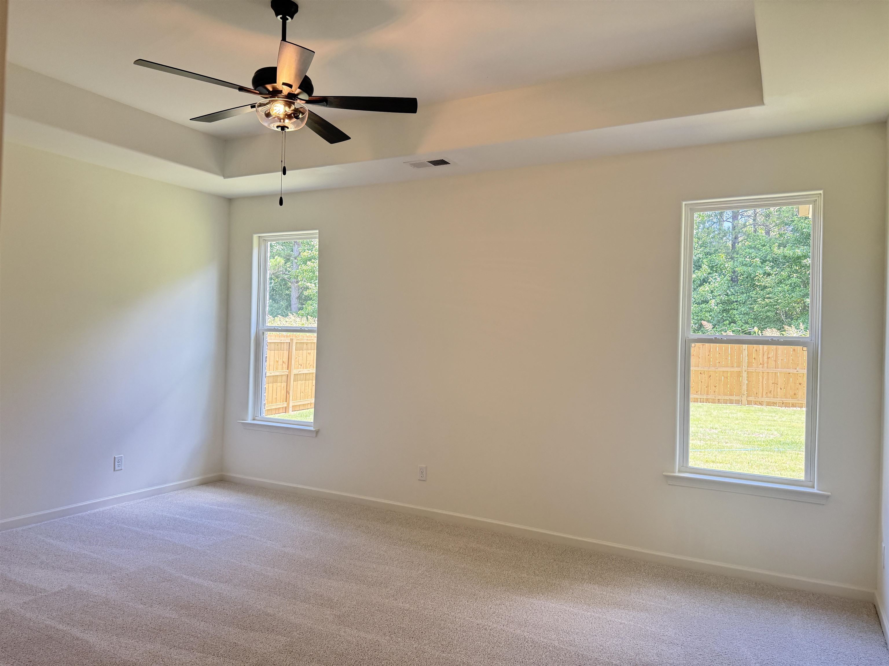 85 Ridgefield Drive Oakland, TN 38060 - Photo 7 of 12 an empty room with a window and a fan