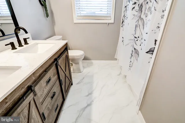 a bathroom with a sink and toilet