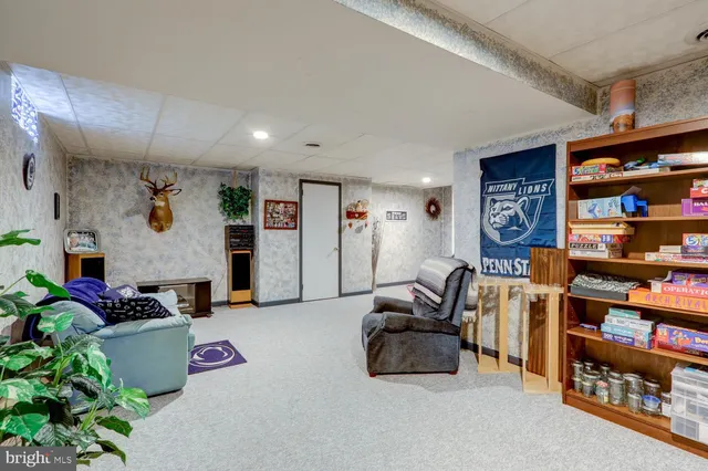 a view of a house with swimming pool and sitting area