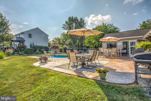 a view of a patio with swimming pool