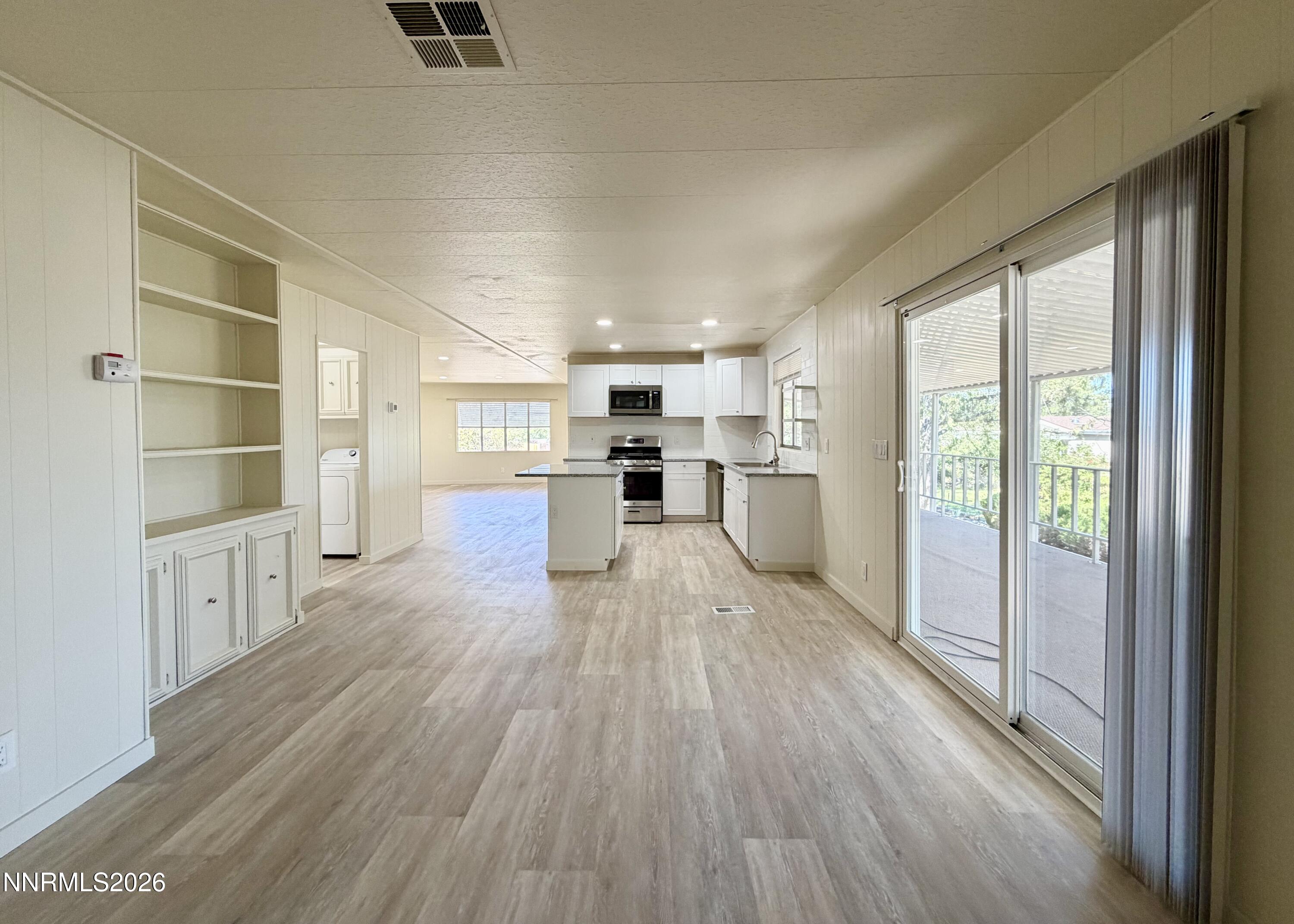 330 Taurus Circle Reno, NV 89521 - Photo 13 of 27 a large space with a large window and wooden floor