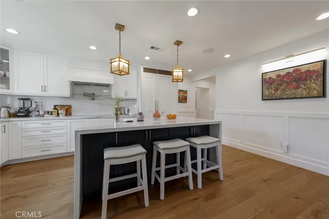 a kitchen with a table and chairs in it