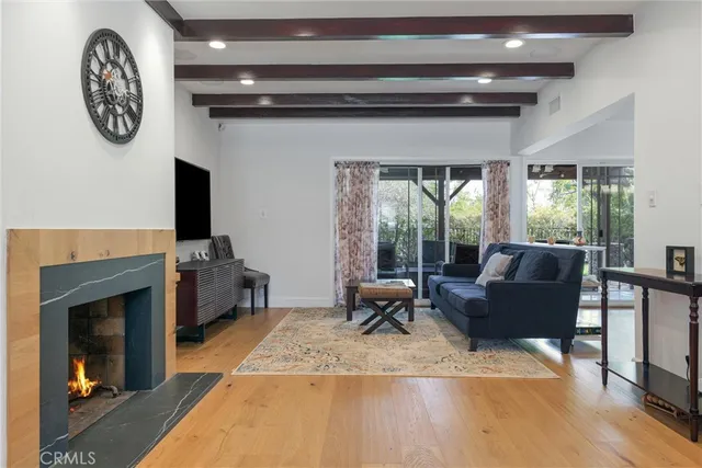 a very nice looking room with a large window and a flat screen tv