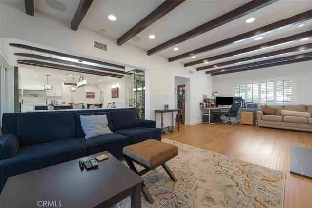 a spacious bedroom with a bed and a table in it