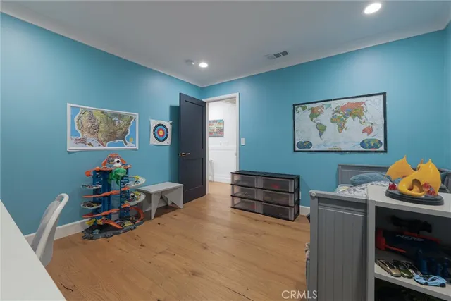 a spacious bedroom with a bed and a table in it