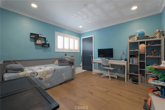 a bed room with furniture and painting on the wall