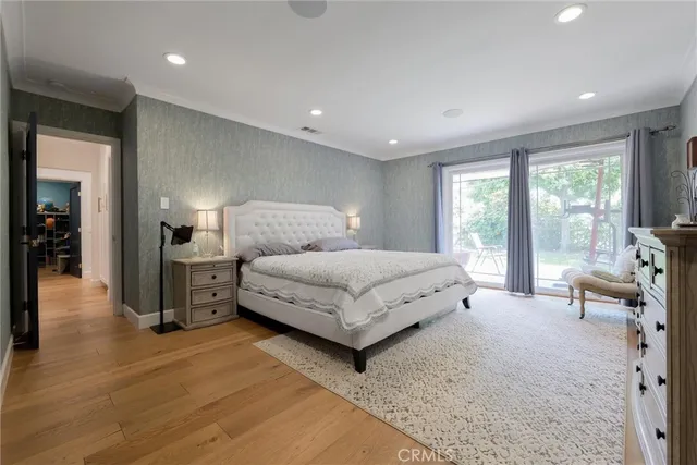 a spacious bedroom with a bed and furniture