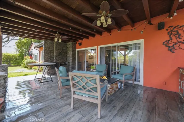 an aerial view of a fireplace with table and chair