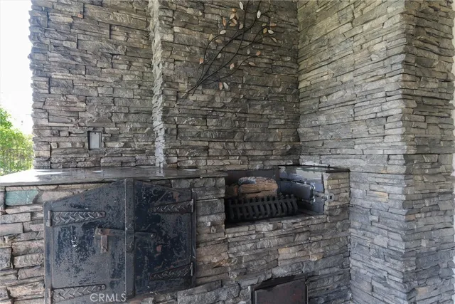 a outdoor living space with furniture and a fireplace