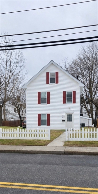 60 Silver Lake Street Athol, MA 01331 - Photo 2 of 37 a front view of a house with a yard and garage