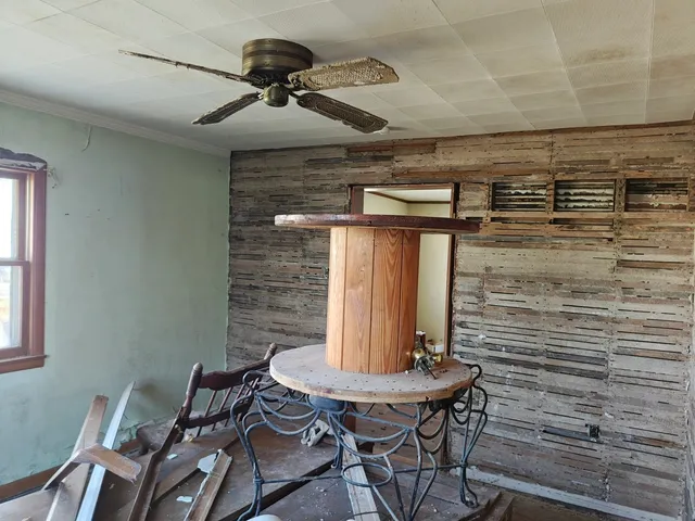 a view of a livingroom with furniture and window