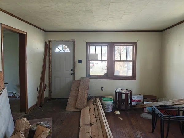 a view of a room with furniture window and wooden floor