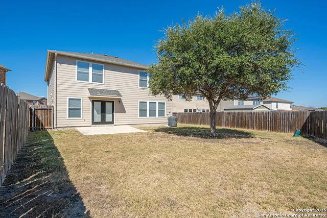 a house with trees in front of it
