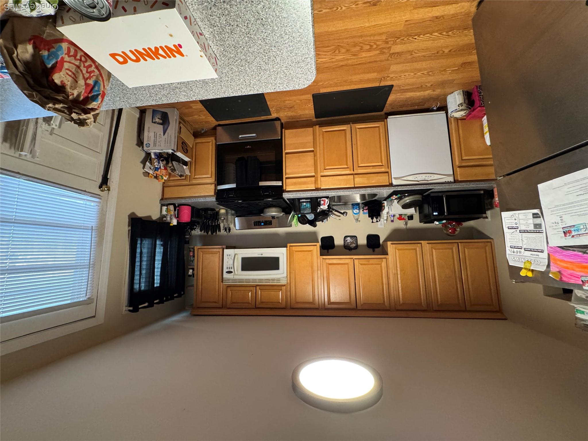 9 Armstrong Avenue Peekskill, NY 10566 - Photo 4 of 16 a kitchen with a refrigerator and a stove top oven
