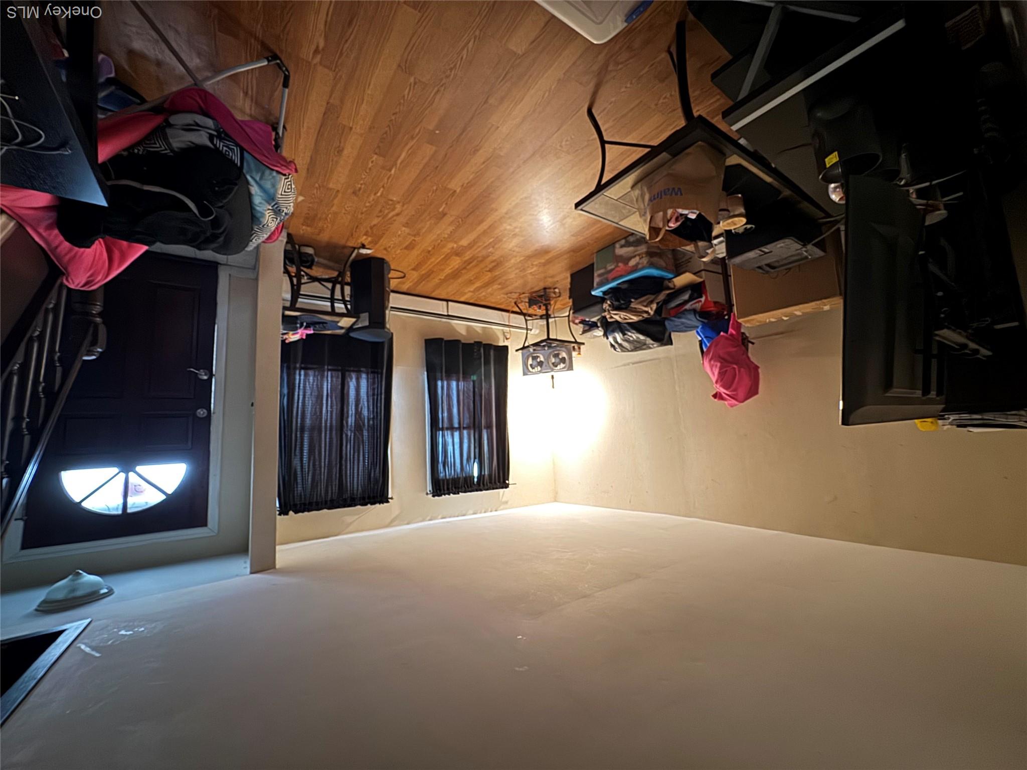 9 Armstrong Avenue Peekskill, NY 10566 - Photo 6 of 16 a living room with furniture a flat screen tv and gym equipment