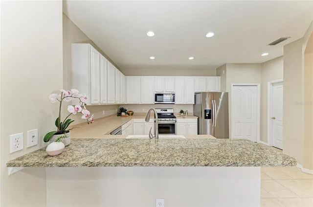 a view of a dining room with furniture and window