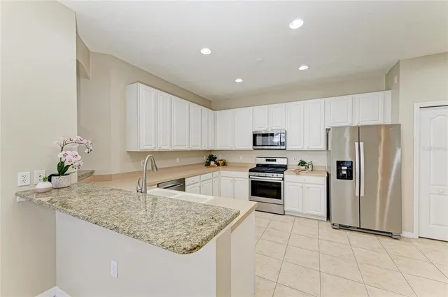 a view of a livingroom with furniture and a potted plant