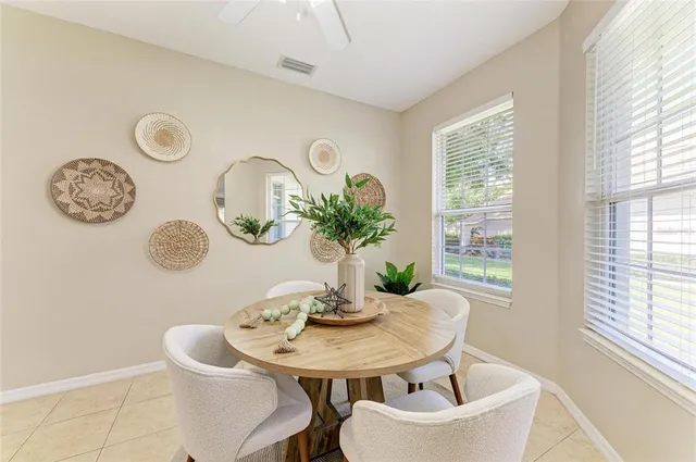 a room with a table and a potted plant