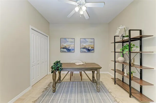 an aerial view of a house with a garden and lake view