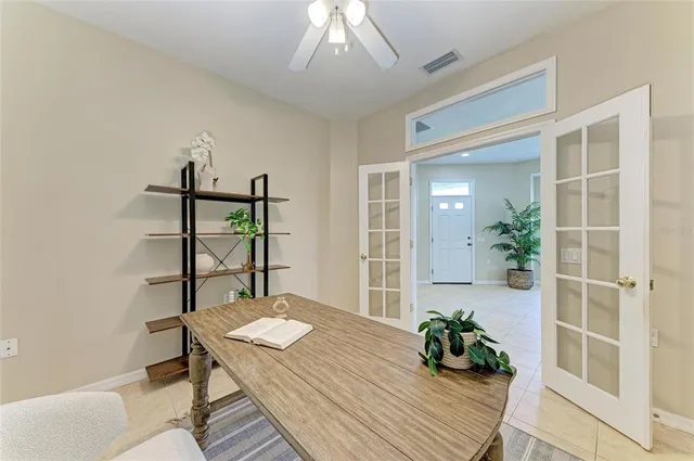 a aerial view of a house with a yard table and chairs