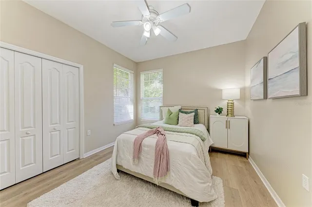 a aerial view of a house with a yard table and chairs