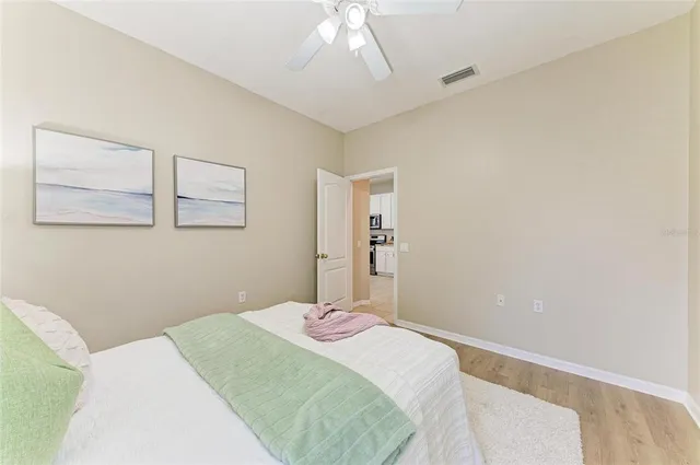 an aerial view of a house with garden space and street view
