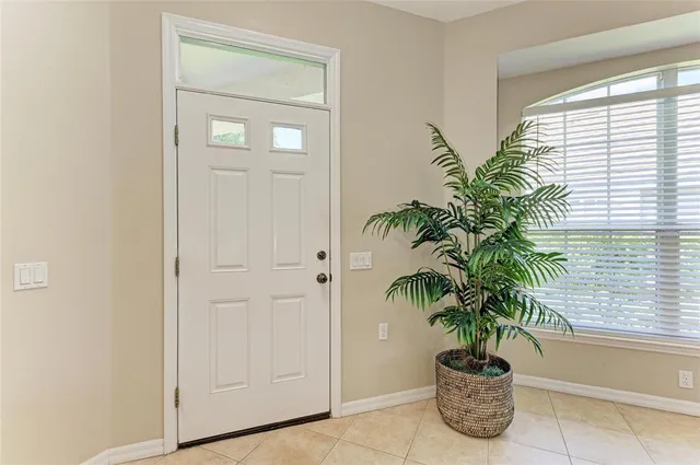 a kitchen with a refrigerator stove and white cabinets