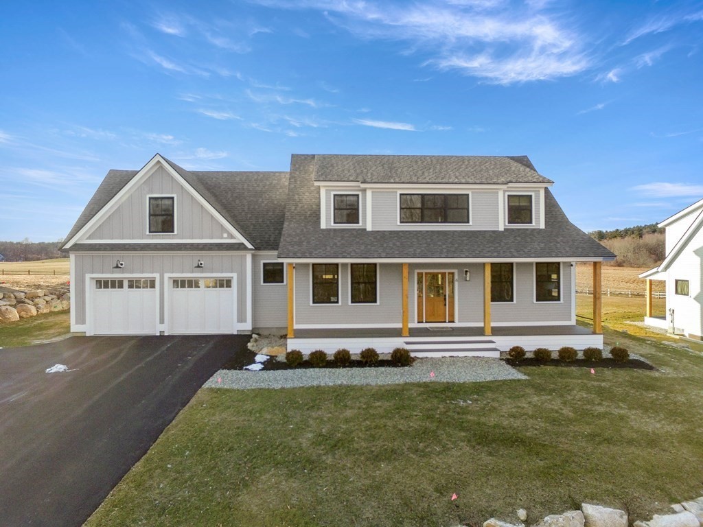 6 Woodman Road Amesbury, MA 01913 - Photo 1 of 37 a front view of a house with a yard