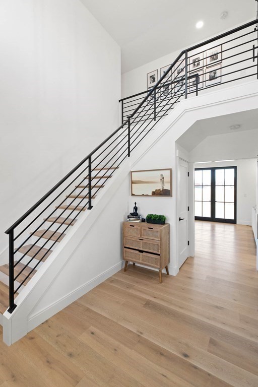 6 Woodman Road Amesbury, MA 01913 - Photo 21 of 37 a view of entryway and hall with wooden floor