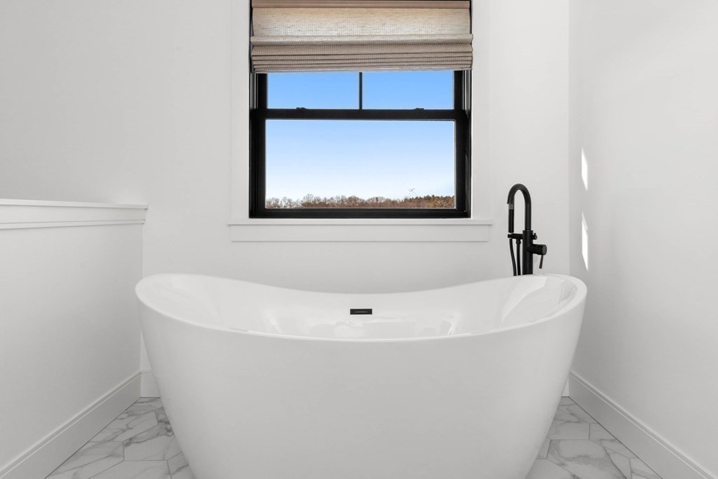6 Woodman Road Amesbury, MA 01913 - Photo 25 of 37 a white bath tub sitting in a bathroom
