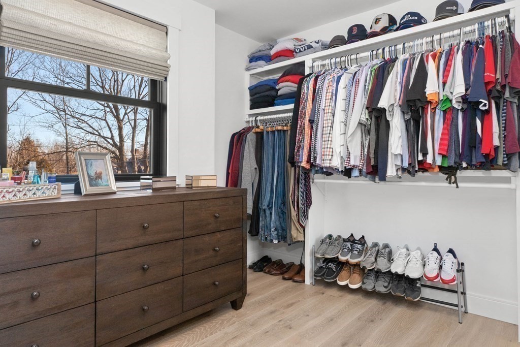 6 Woodman Road Amesbury, MA 01913 - Photo 26 of 37 a view of walk in closet with clothes and shoes
