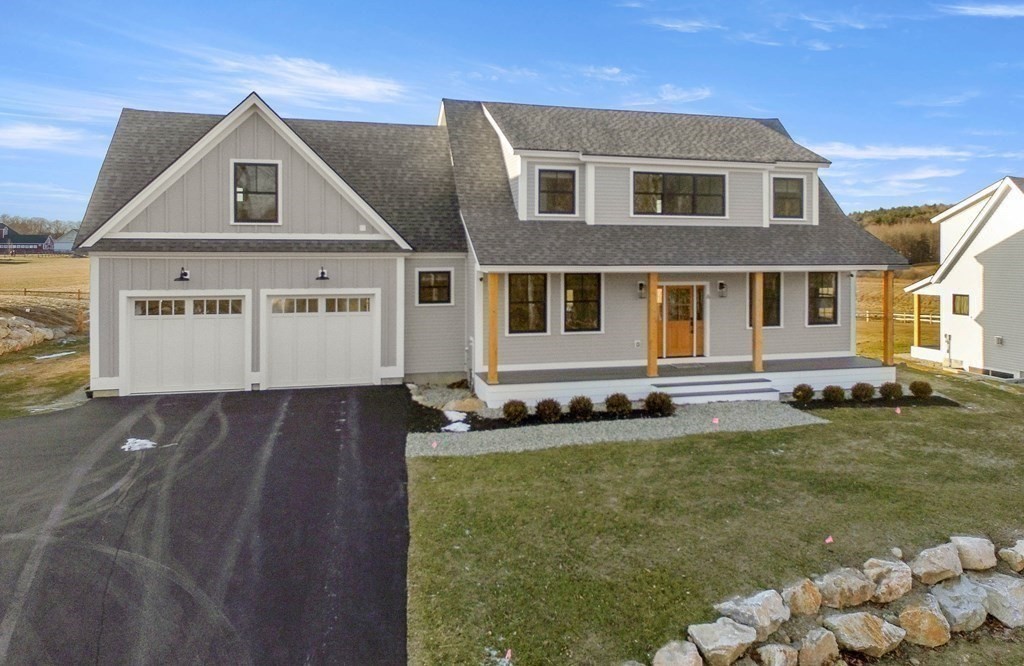 6 Woodman Road Amesbury, MA 01913 - Photo 32 of 37 a front view of a house with a yard