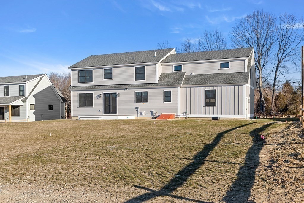 6 Woodman Road Amesbury, MA 01913 - Photo 33 of 37 a front view of a house with a yard