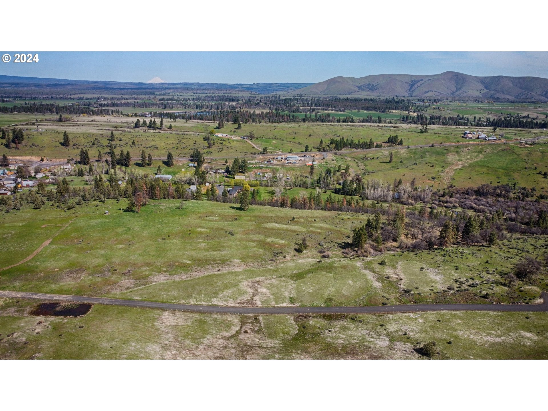 Undisclosed Address Wamic, OR 97063 - Photo 3 of 9 a view of a field with an ocean