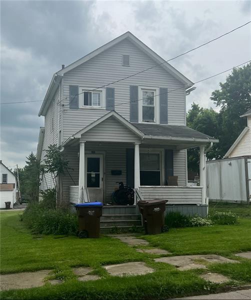 515 Davis Street Sharon, PA 16146 - Photo 2 of 2 a view of a white house with a big yard and potted plants