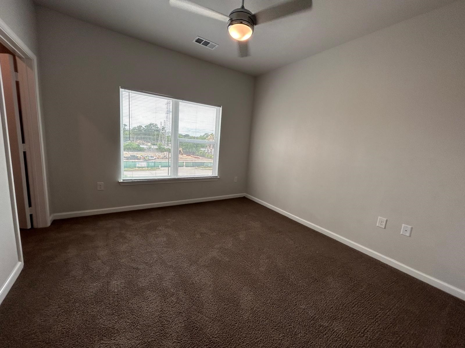 2136 West 34th Street, Unit 1116 Houston, TX 77018 - Photo 9 of 11 an empty room with a window