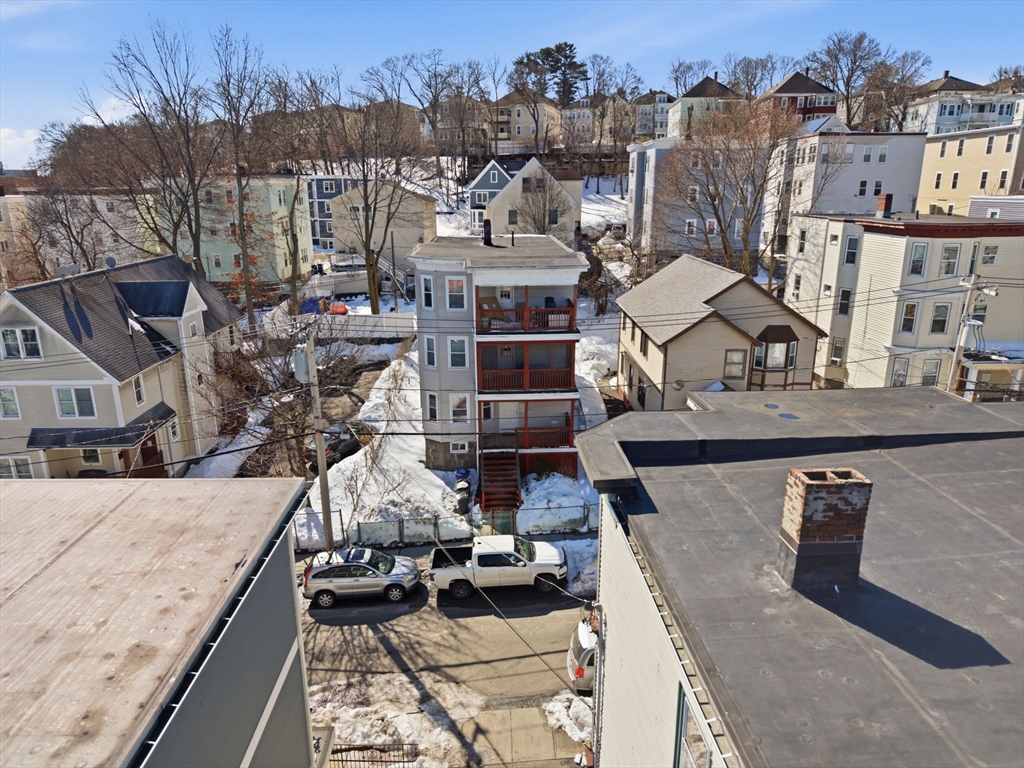 22 Deering Road, Unit 1 Boston, MA 02126 - Photo 3 of 12 a view of a house with roof deck