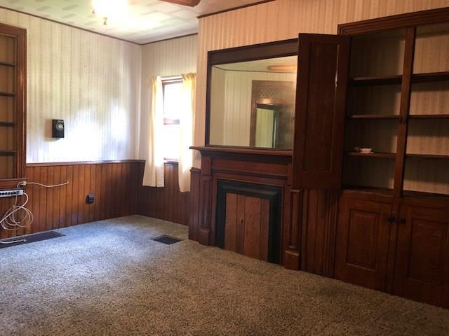 676 Sawyer Road Apollo, PA 15613 - Photo 3 of 19 LARGE LIVINGROOM WITH DECORATIVE FIREPLACE AND BUILTINS