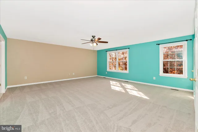 a bathroom with a sink a toilet a large mirror and shower