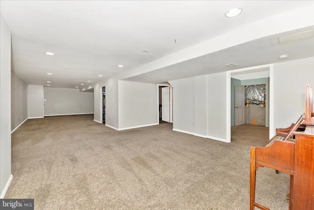 a view of a house with snow on the yard