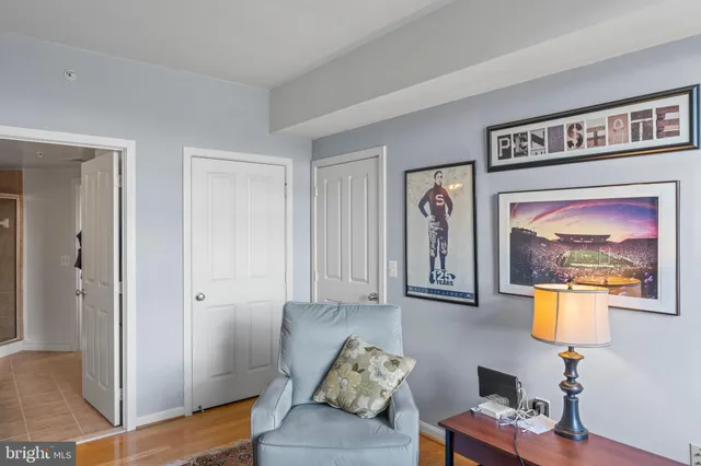 a bedroom with a bed and a lamp on table