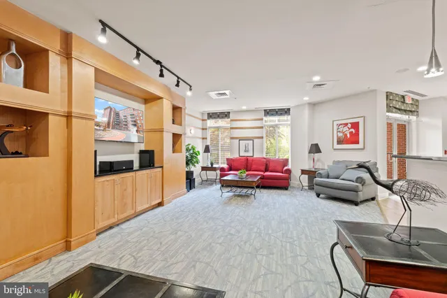 a living room with furniture and a table